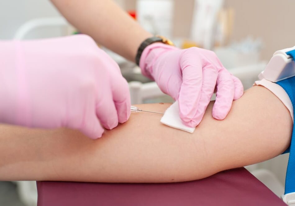 Nurse,Is,Collecting,Blood,From,Patient,At,Clinic,,Hospital.